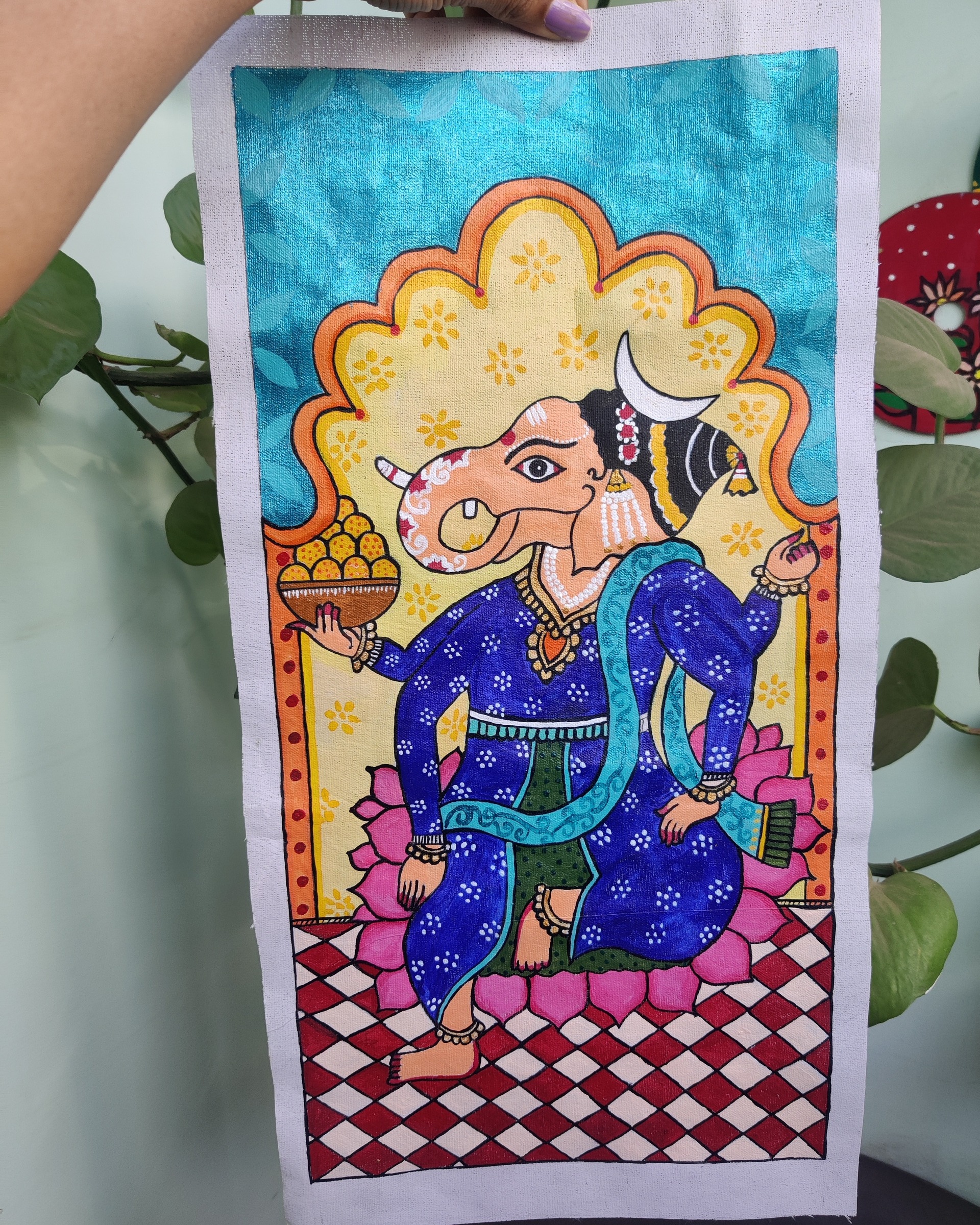 Ganesha seated under a scalloped arch with a lotus throne, in Pichwai tradition.