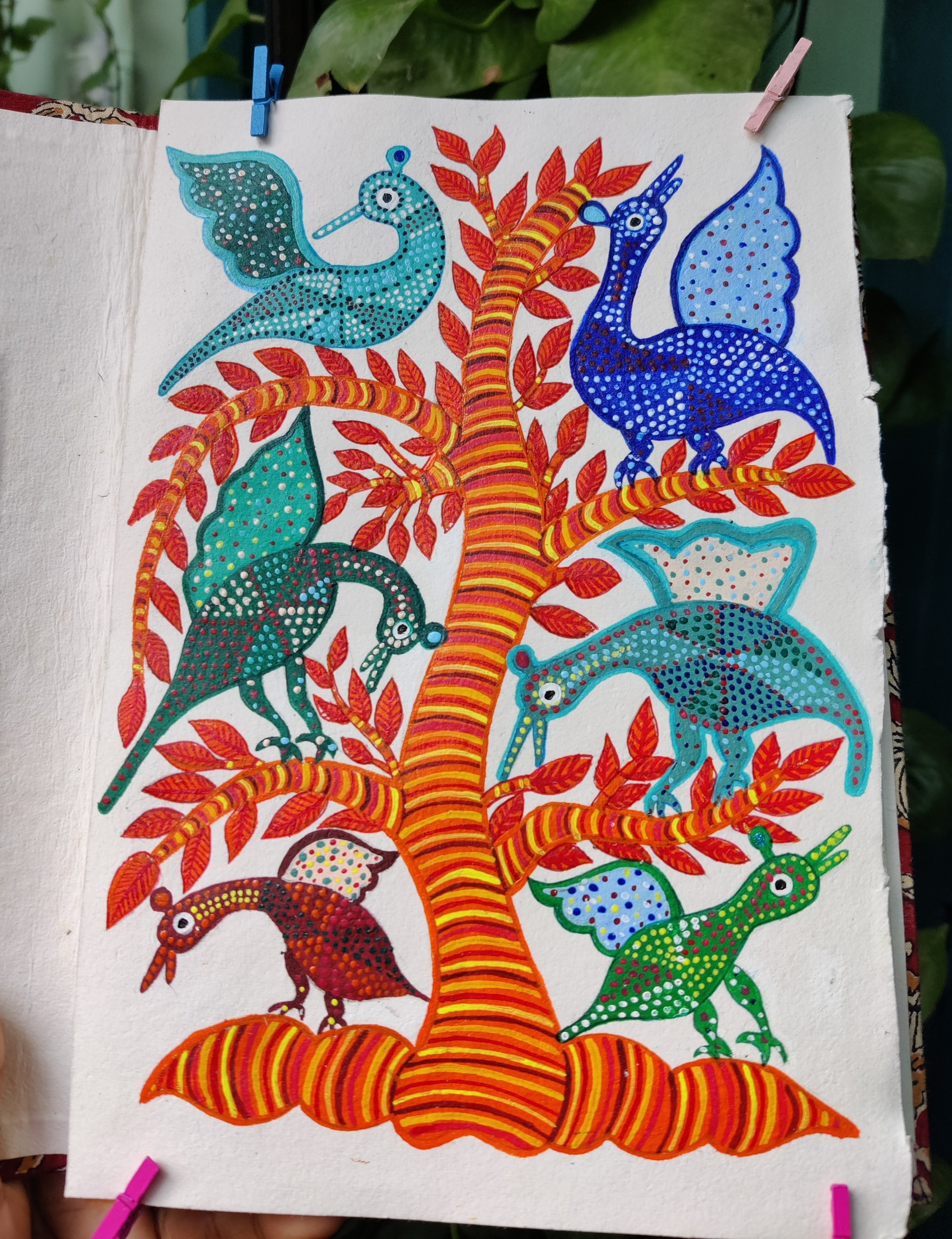 Striped tree with six dot-patterned birds among red leaves, in Gond technique.