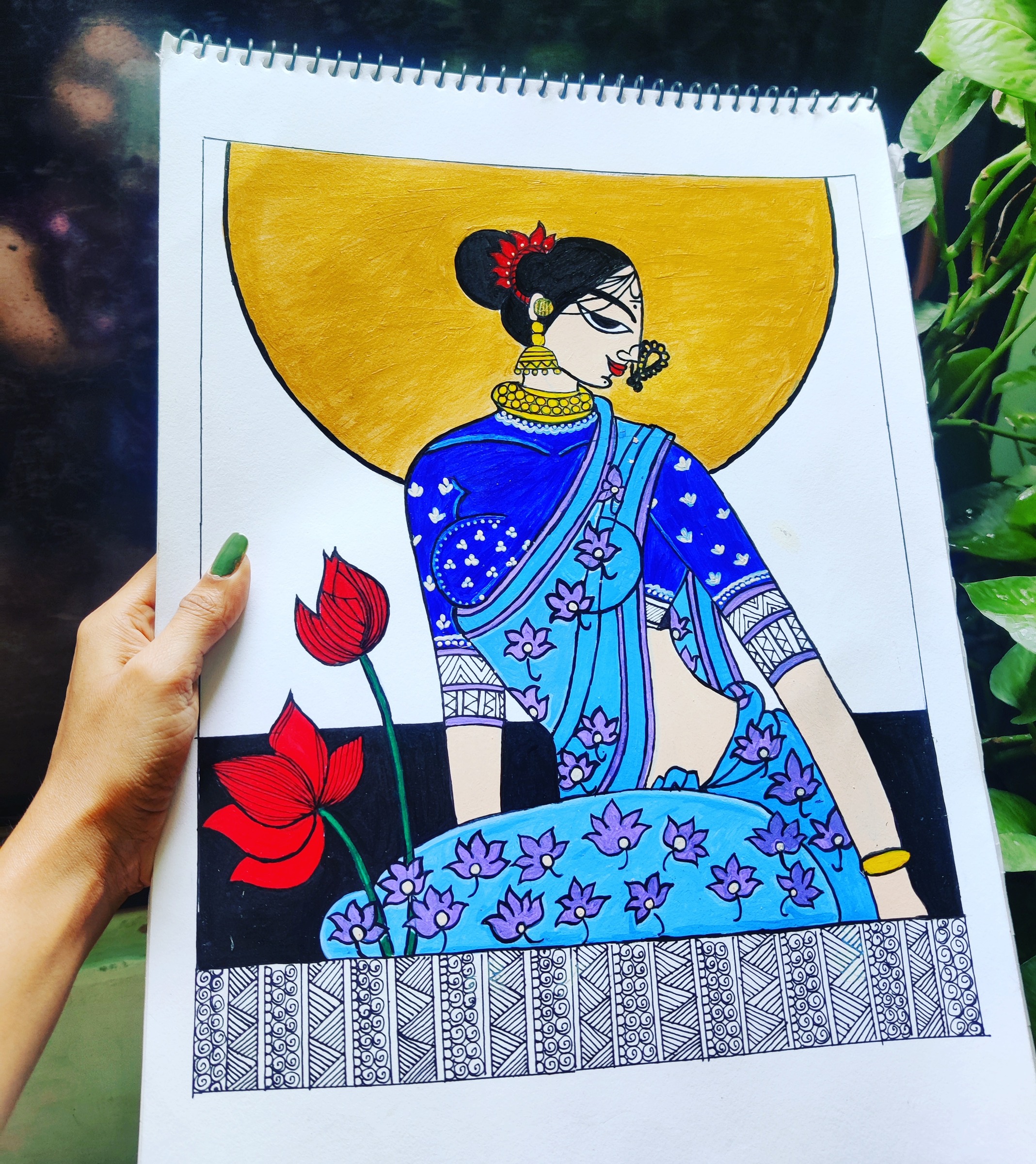 Stylized woman in indigo sari with golden halo, holding lotus flowers.