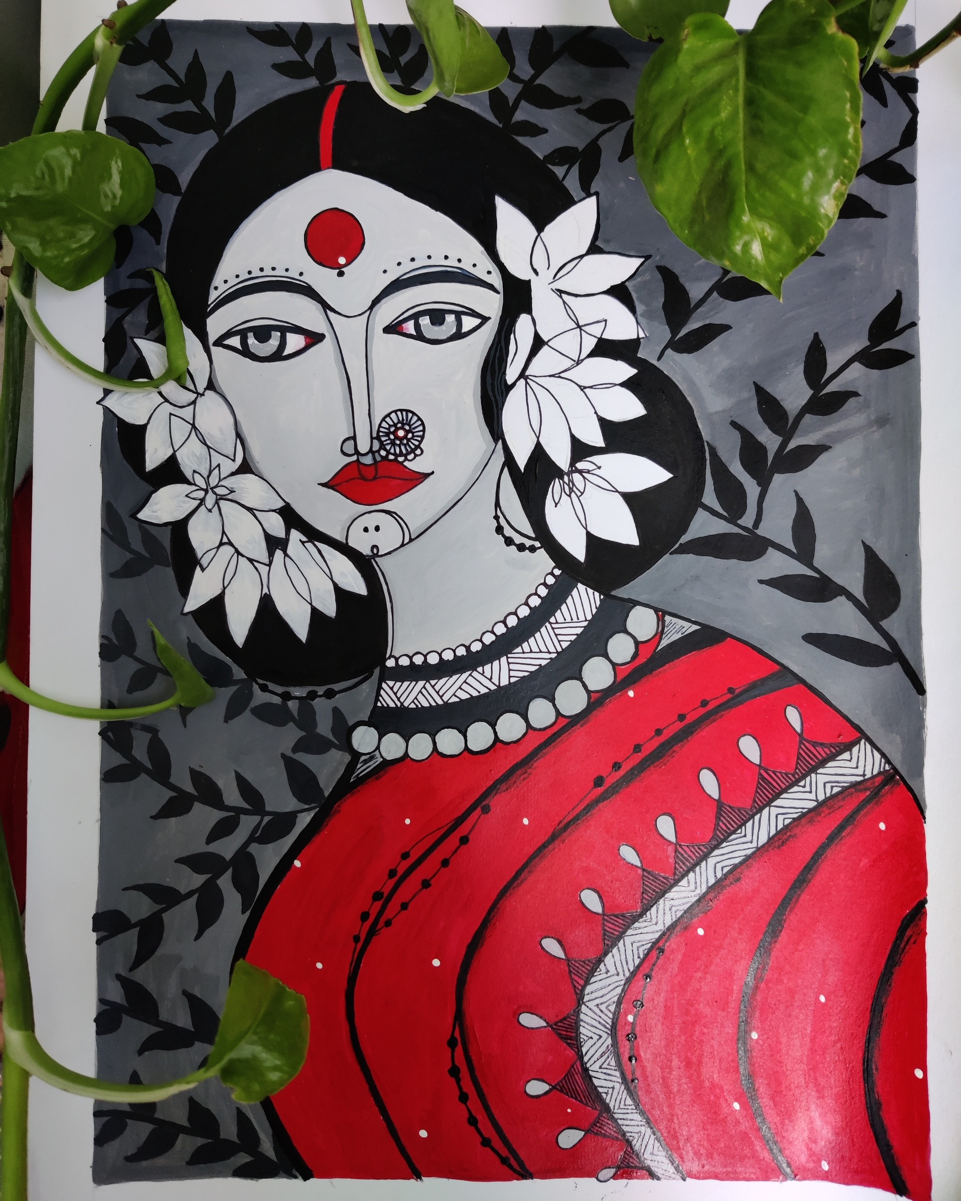 Stylized portrait in red and grey with foliage backdrop and floral hair detail.